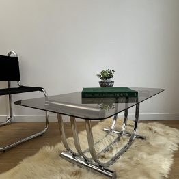 VENDU - Table basse verre fumé et pied chrome par Yves Boutboul